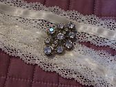 lace and brooch for bouquet handle.
