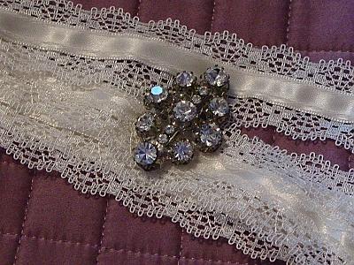 lace and brooch for bouquet handle.