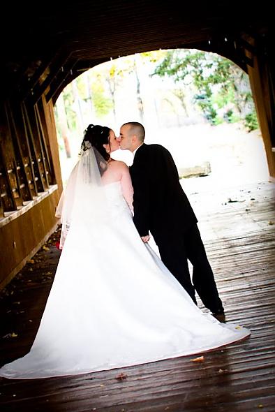kissing on a covered bridge