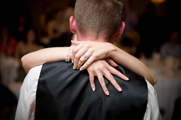 First dance, holding on tight.