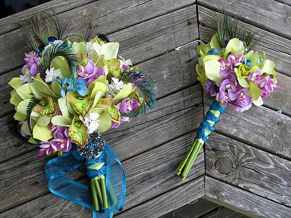 Peacock feather and orchids bride and bridesmaid bouquets