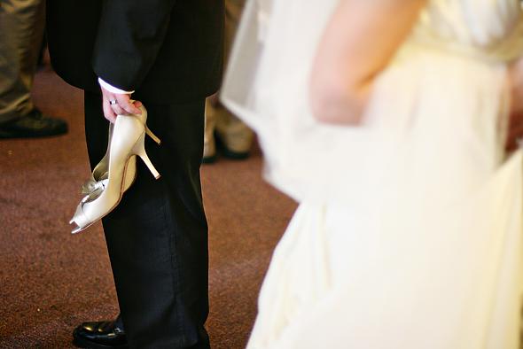 new husband holding my shoes!